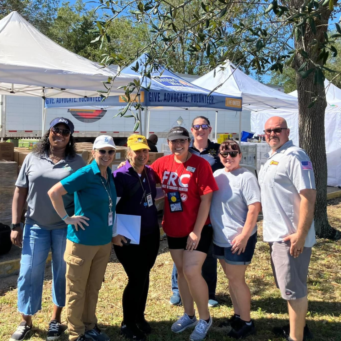 Recovery staff and volunteers in a group outside