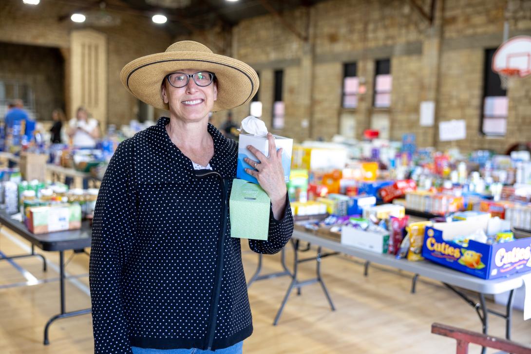 Woman standing in a donation center
