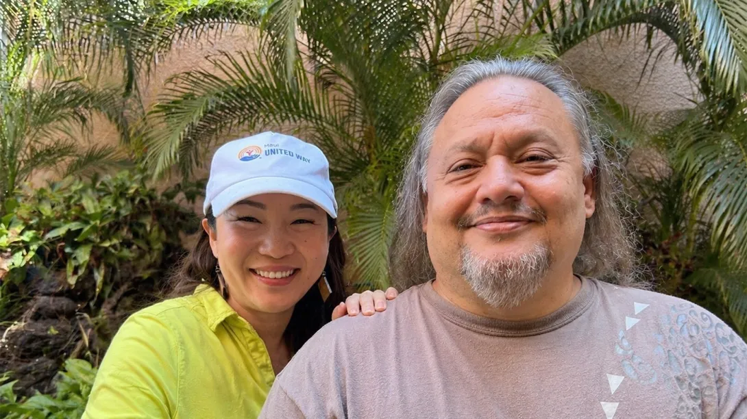 Jeeyun Lee, CEO of Maui United Way, and Keola smiling
